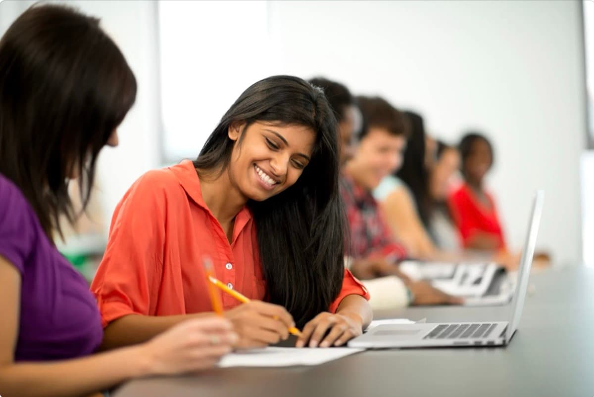 Students studying in classroom at Jothis College